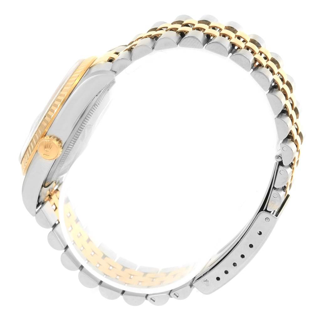 The image shows a side view of a Rolex Datejust 16233 Steel and Gold (two tone) White Dial 16233 Steel and Gold (two tone) White Dial watch, highlighting its two-tone bracelet and crown.