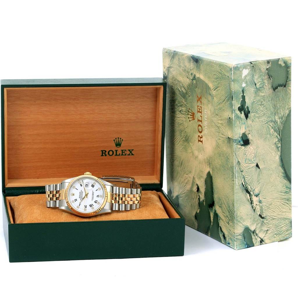The Rolex Datejust 16233 Steel and Gold (two tone) White Dial 16233 Steel and Gold (two tone) White Dial watch is displayed in its box at an angle showing its face, bracelet, and part of the side.