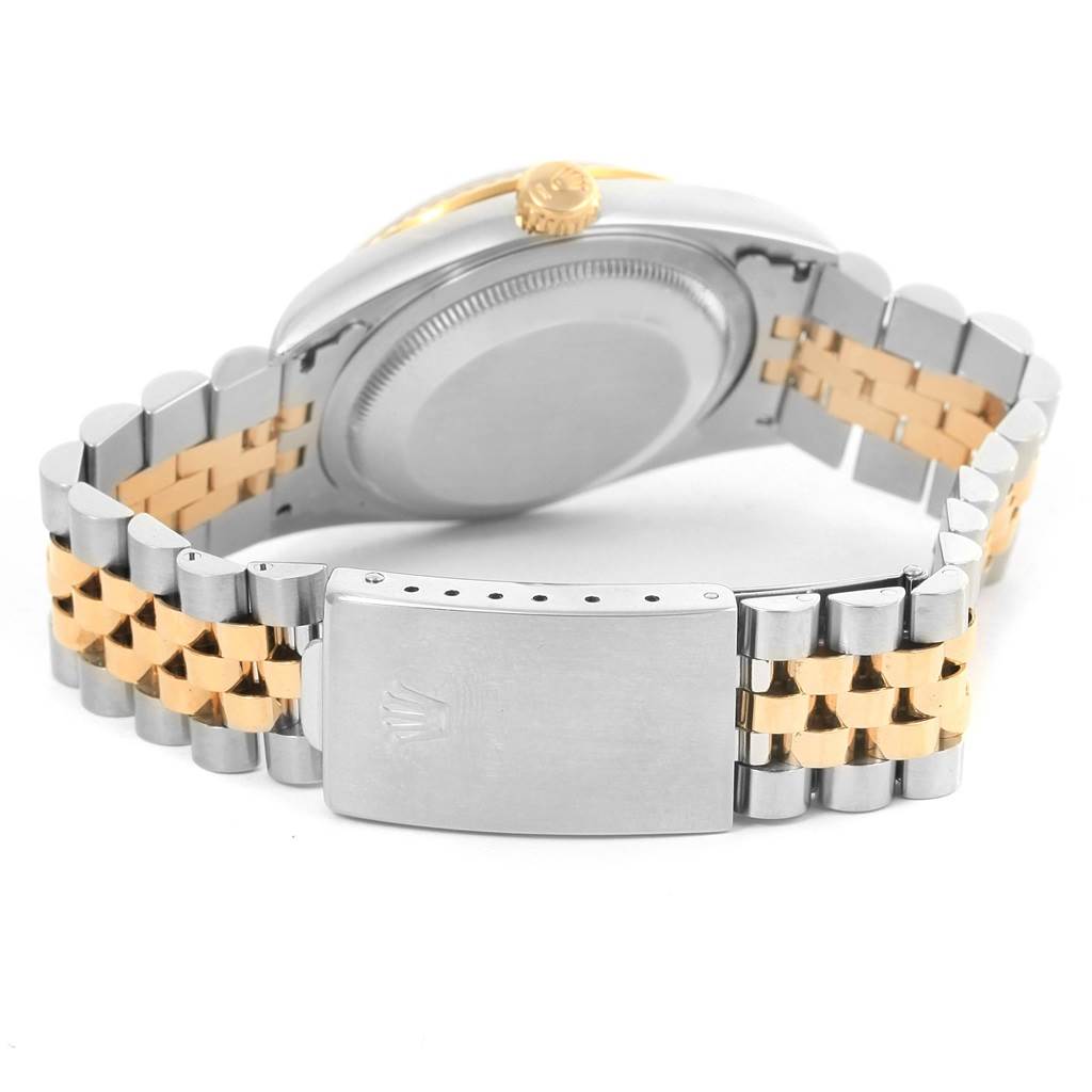 The image shows the back view of a Rolex Datejust 16233 Steel and Gold (two tone) White Dial 16233 Steel and Gold (two tone) White Dial model, highlighting its case back, crown, and bracelet clasp.