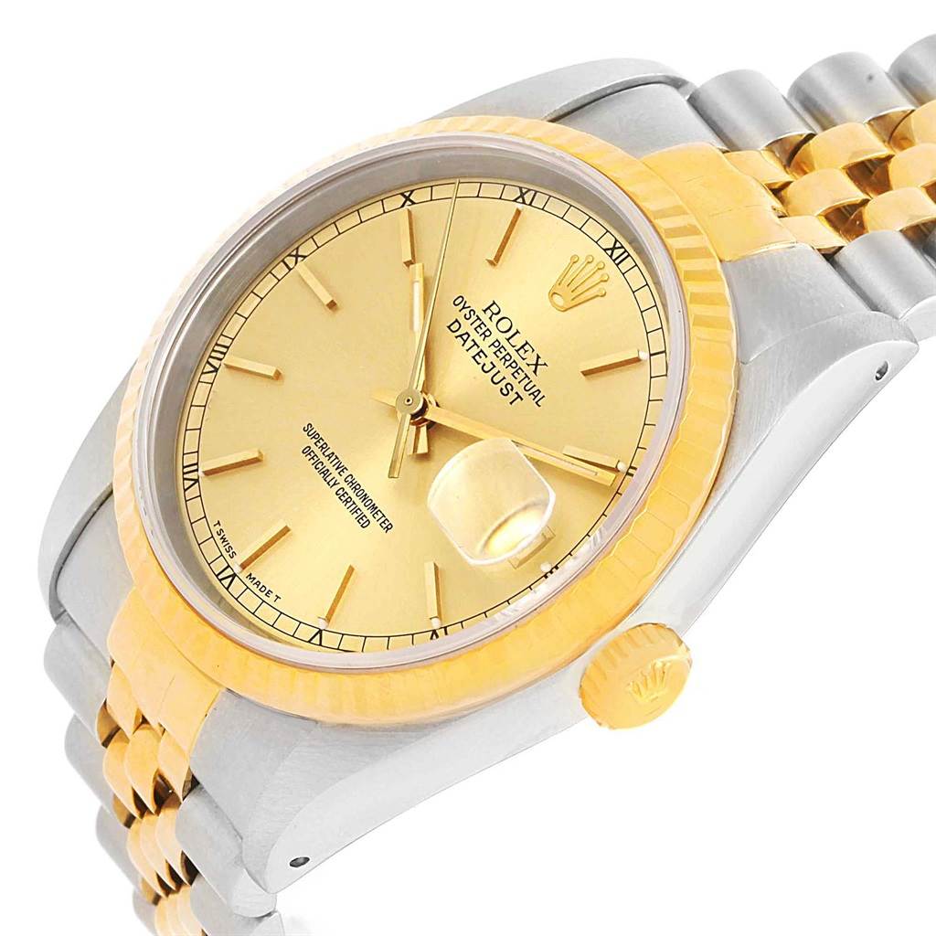 This image shows a gold and silver Rolex Datejust 16233 Steel and Gold (two tone) Champagne Dial 16233 Steel and Gold (two tone) Champagne Dial model watch at an angled view, featuring its dial, bezel, crown, and part of the bracelet.