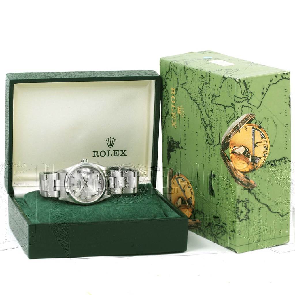 The Rolex Datejust 16200 Men's Stainless Steel Silver Dial 16200 Men's Stainless Steel Silver Dial watch is shown from a front angle, inside its open green box, with the box lid and outer packaging visible.