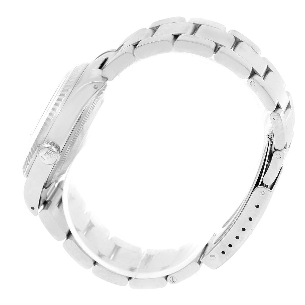 This image shows a side view of the Rolex Datejust 16234 Men's Stainless Steel Blue Dial 16234 Men's Stainless Steel Blue Dial watch focusing on the crown, case, and bracelet.