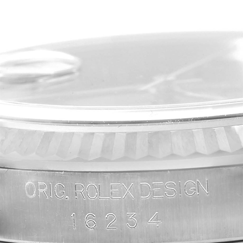 The image shows the side view of a Rolex Datejust 16234 Men's Stainless Steel Black Dial 16234 Men's Stainless Steel Black Dial watch, highlighting the bezel and the engraved model number 16234.