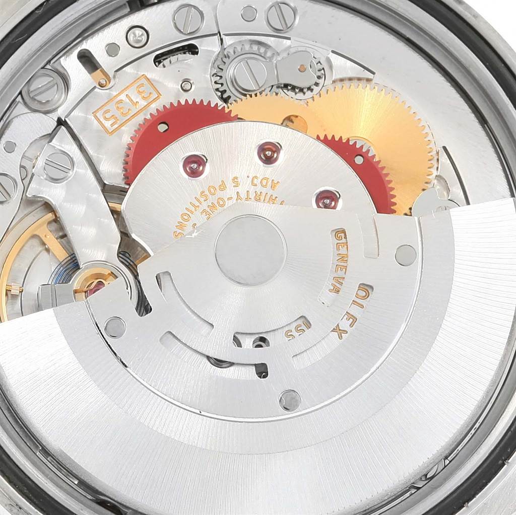 This is the underside view of the watch movement for the Rolex Datejust 116200 Men's Stainless Steel Blue Dial 116200 Men's Stainless Steel Blue Dial model, showing the gears and rotor mechanism.