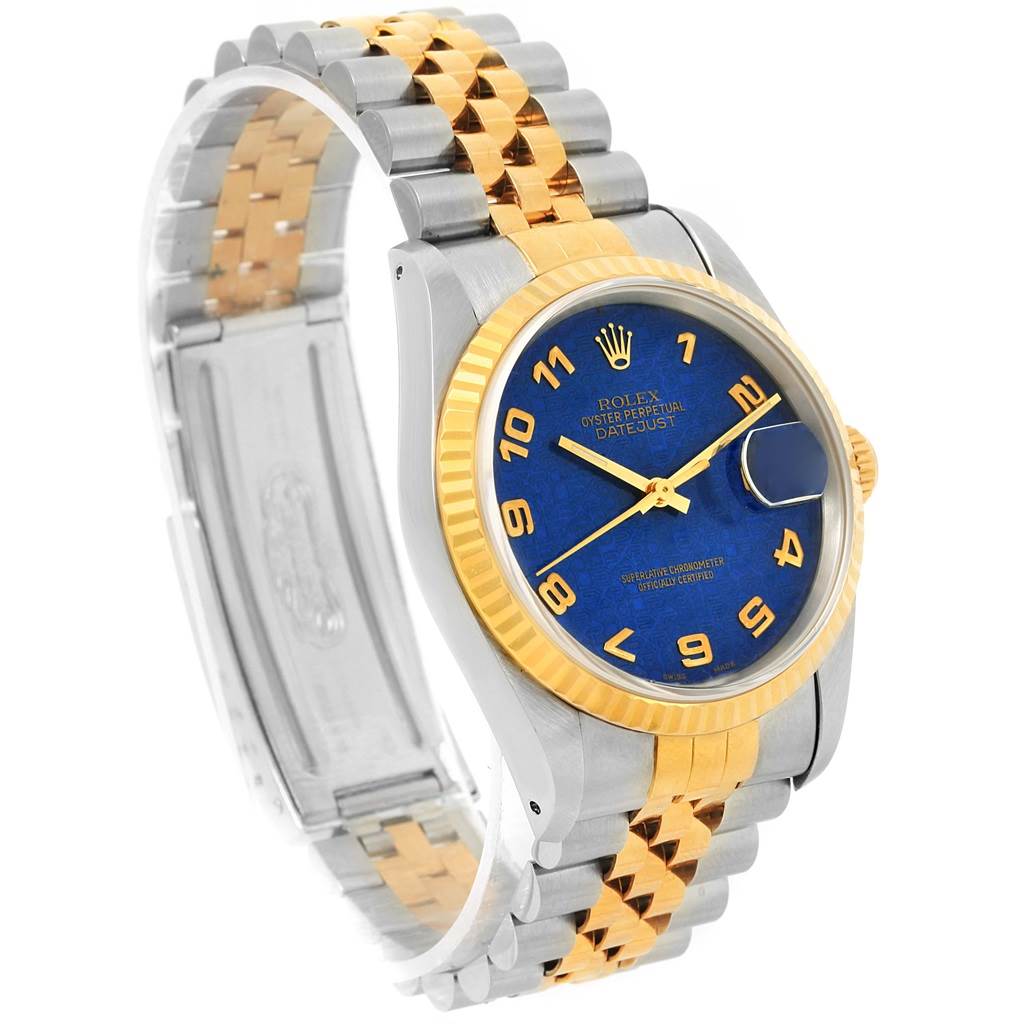 This image shows an angled view of a Rolex Datejust 16233 Men's Steel and Gold (two tone) Blue Dial 16233 Men's Steel and Gold (two tone) Blue Dial watch highlighting its blue dial, gold bezel, and two-tone bracelet.