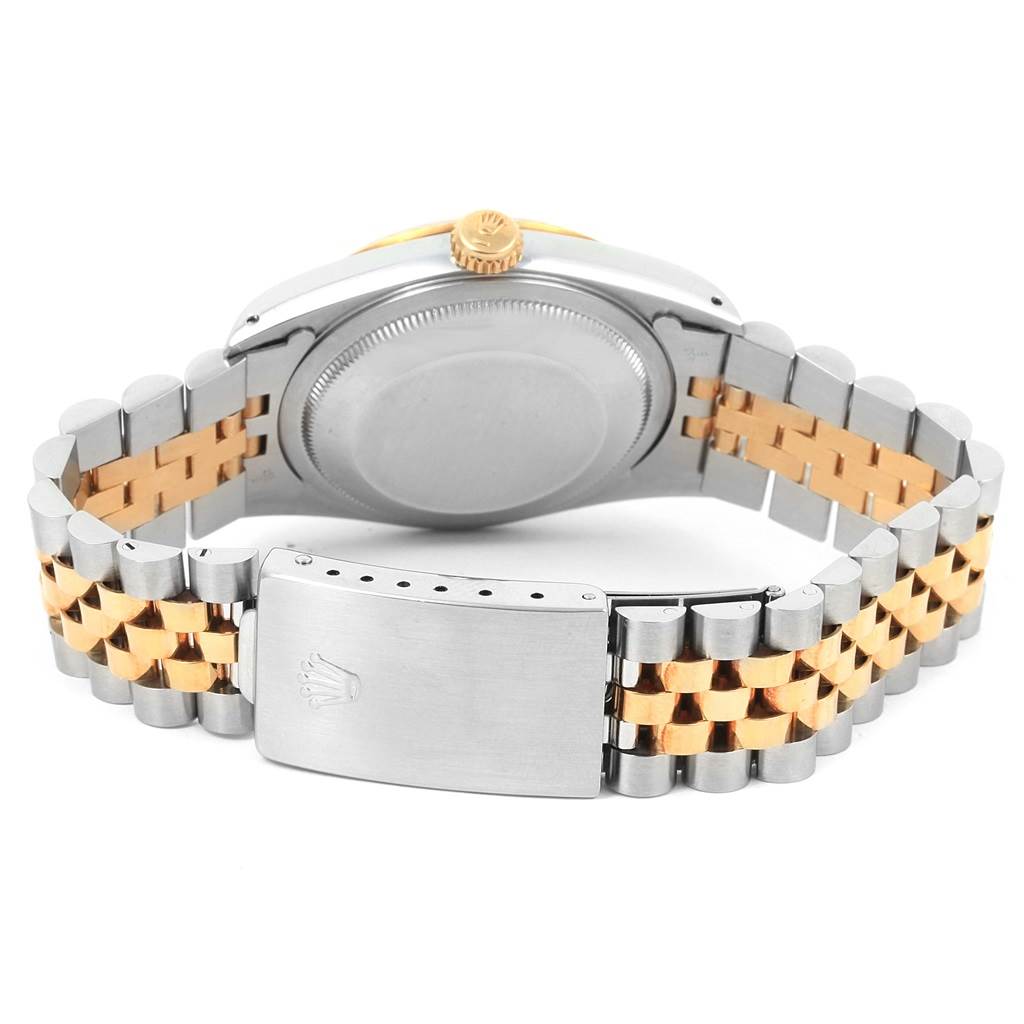 The image shows the back case, crown, and jubilee bracelet with a clasp of a Rolex Datejust 16233 Men's Steel and Gold (two tone) Blue Dial 16233 Men's Steel and Gold (two tone) Blue Dial watch.