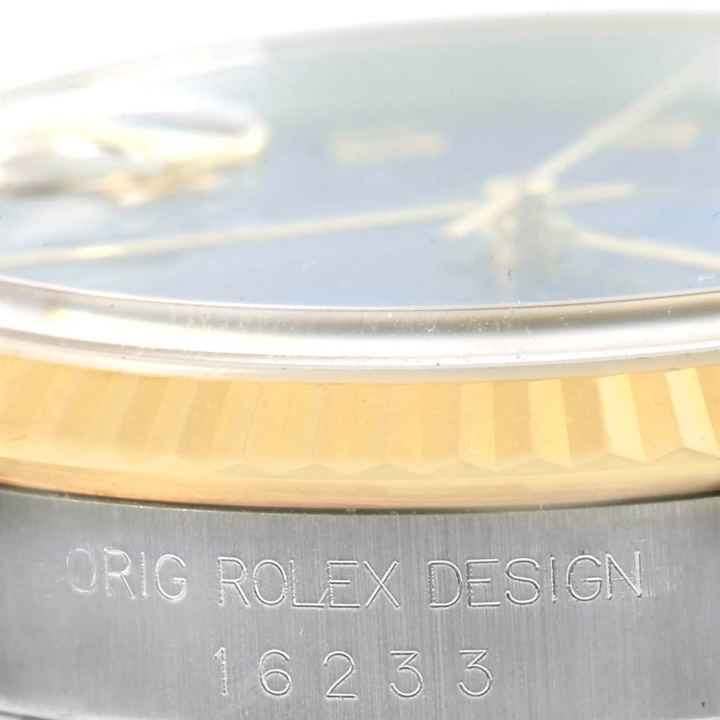 The image shows a close-up of the side of a Rolex Datejust 16233 Men's Steel and Gold (two tone) Blue Dial 16233 Men's Steel and Gold (two tone) Blue Dial watch, highlighting the bezel and model number 16233 engraved on the case.