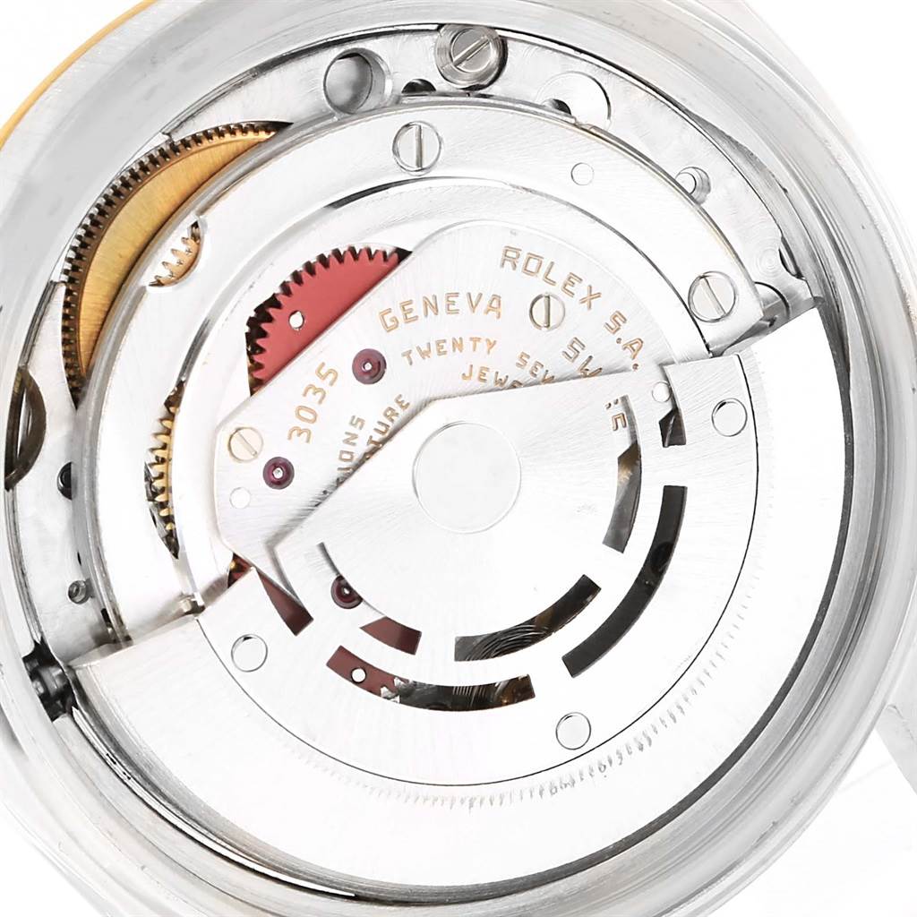 The image shows a close-up of the internal mechanism of a Rolex Datejust 16013 Stainless Steel Champagne Dial 16013 Stainless Steel Champagne Dial watch, highlighting the movement components.