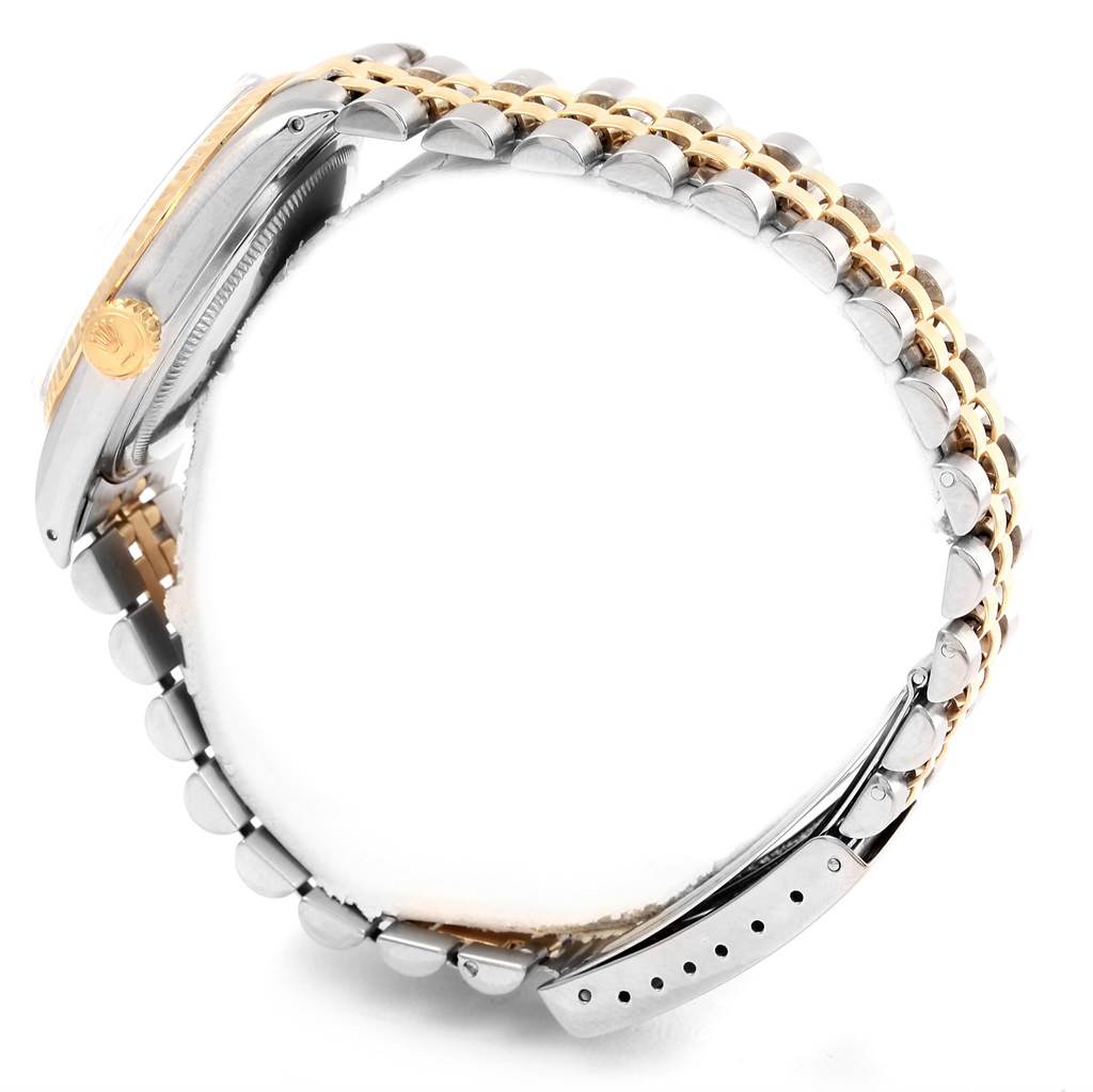 The image shows the side view and bracelet of a Rolex Datejust 16013 Men's Stainless Steel Champagne Dial 16013 Men's Stainless Steel Champagne Dial, with focus on the crown and two-tone metal links.