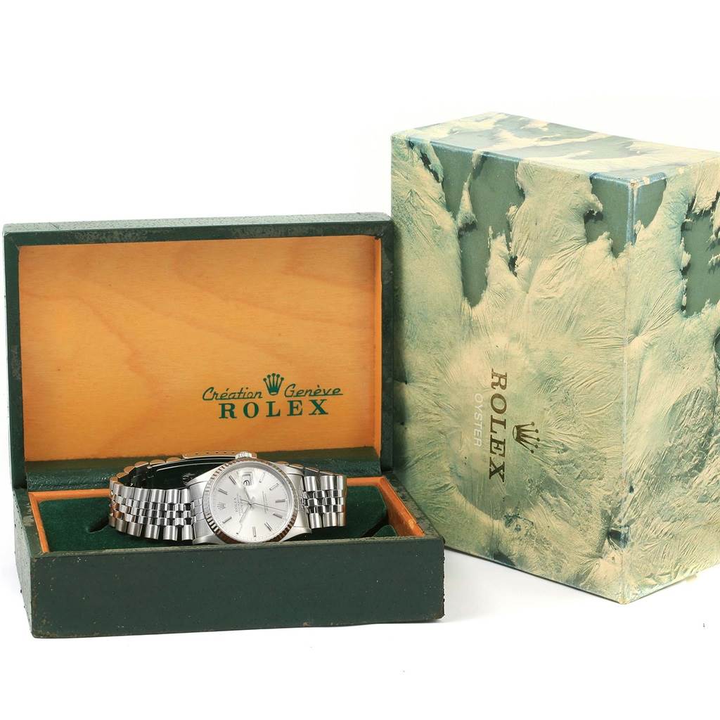 The Rolex Datejust 16234 Men's Stainless Steel Silver Dial 16234 Men's Stainless Steel Silver Dial watch is shown inside its open box, with the green Rolex packaging visible beside it.