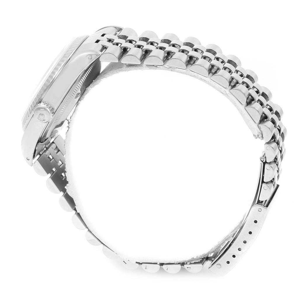 This side-angle view of the Rolex Datejust 16234 Men's Stainless Steel Silver Dial 16234 Men's Stainless Steel Silver Dial model shows the watch band and the crown on the side of the case.