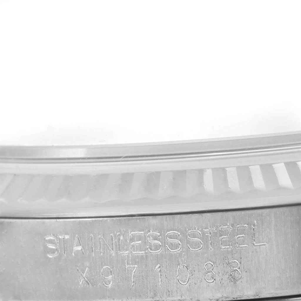 The image shows a close-up side view of the stainless steel case and fluted bezel of a Rolex Datejust 16234 Men's Stainless Steel Silver Dial 16234 Men's Stainless Steel Silver Dial watch.