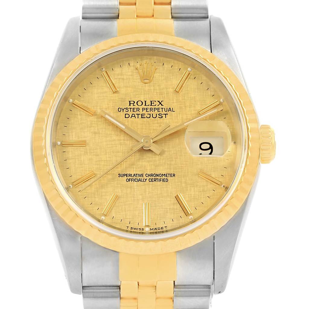 This image shows a front view of a Rolex Datejust 16233 Men's Steel and Gold (two tone) Champagne Dial 16233 Men's Steel and Gold (two tone) Champagne Dial watch, highlighting its gold dial, fluted bezel, and the two-tone metal bracelet.