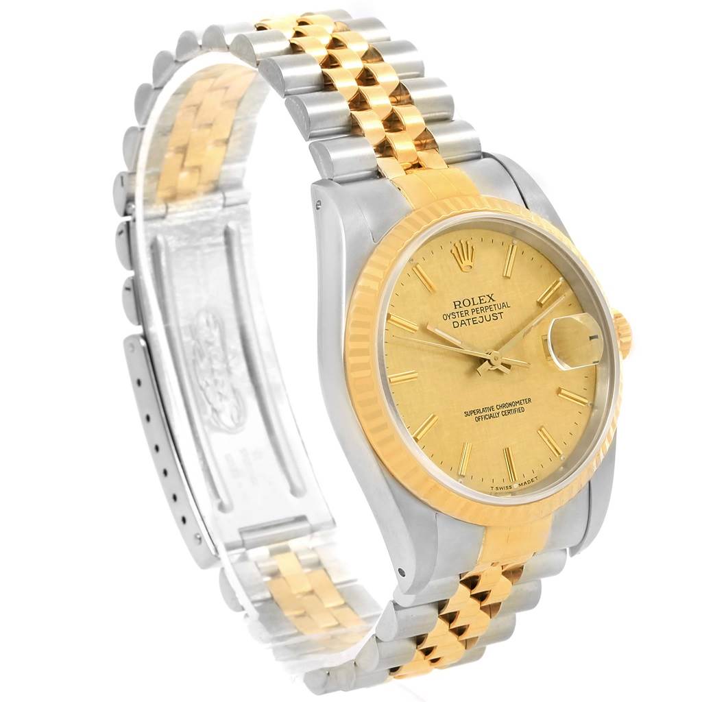 The image shows a side angle of a Rolex Datejust 16233 Men's Steel and Gold (two tone) Champagne Dial 16233 Men's Steel and Gold (two tone) Champagne Dial watch, highlighting the bezel, dial, case, and two-tone Jubilee bracelet.