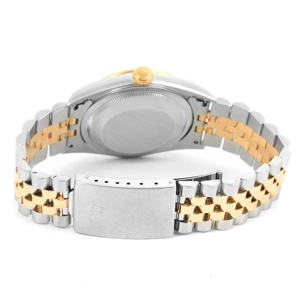 This image shows the back case and clasp of a Rolex Datejust 16233 Men's Steel and Gold (two tone) Champagne Dial 16233 Men's Steel and Gold (two tone) Champagne Dial watch, featuring a two-tone bracelet.