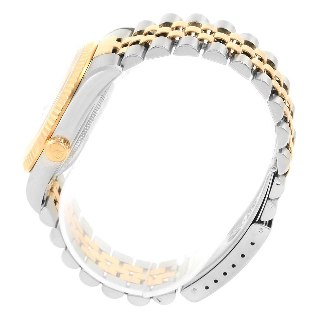 This image shows a side view of a Rolex Datejust 16233 Men's Steel and Gold (two tone) Beige Dial 16233 Men's Steel and Gold (two tone) Beige Dial watch, highlighting the two-tone bracelet and the crown.