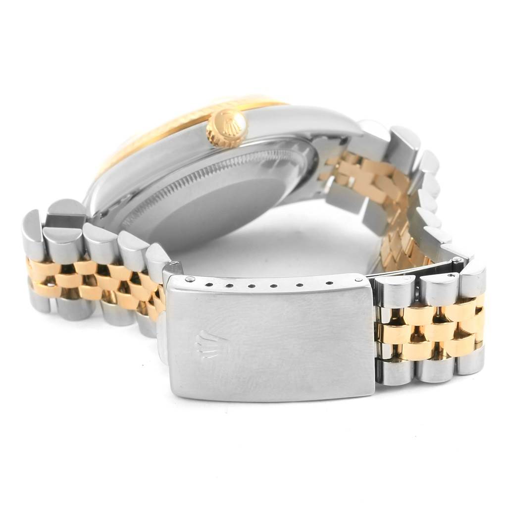 The image shows a side view of the Rolex Datejust 16233 Men's Steel and Gold (two tone) Beige Dial 16233 Men's Steel and Gold (two tone) Beige Dial watch's clasp, bracelet, and crown.