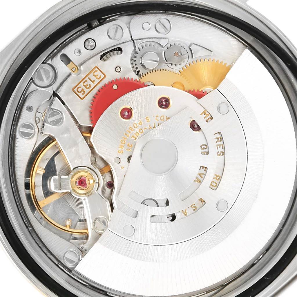 This image shows the movement and internal components of a Rolex Datejust 16233 Men's Steel and Gold (two tone) Beige Dial 16233 Men's Steel and Gold (two tone) Beige Dial watch.