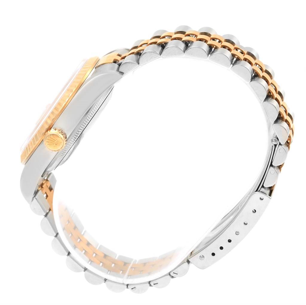 This image shows a side view of a Rolex Datejust 16233 Men's Steel and Gold (two tone) Champagne Dial 16233 Men's Steel and Gold (two tone) Champagne Dial watch, highlighting the case, crown, and Jubilee bracelet.