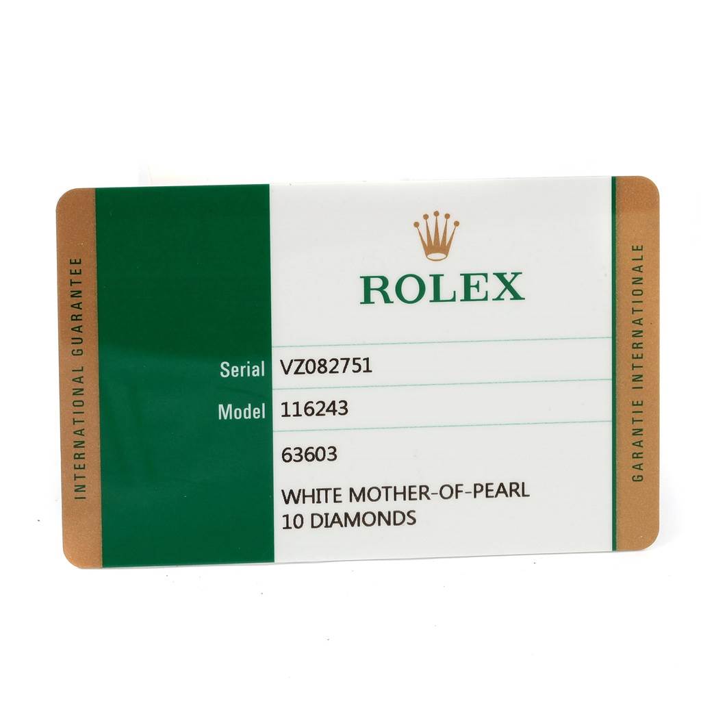 The image shows the warranty card for the Rolex Datejust 116243 Women's Stainless Steel Mother of Pearl Dial 116243 Women's Stainless Steel Mother of Pearl Dial model, providing serial and model numbers along with material details.