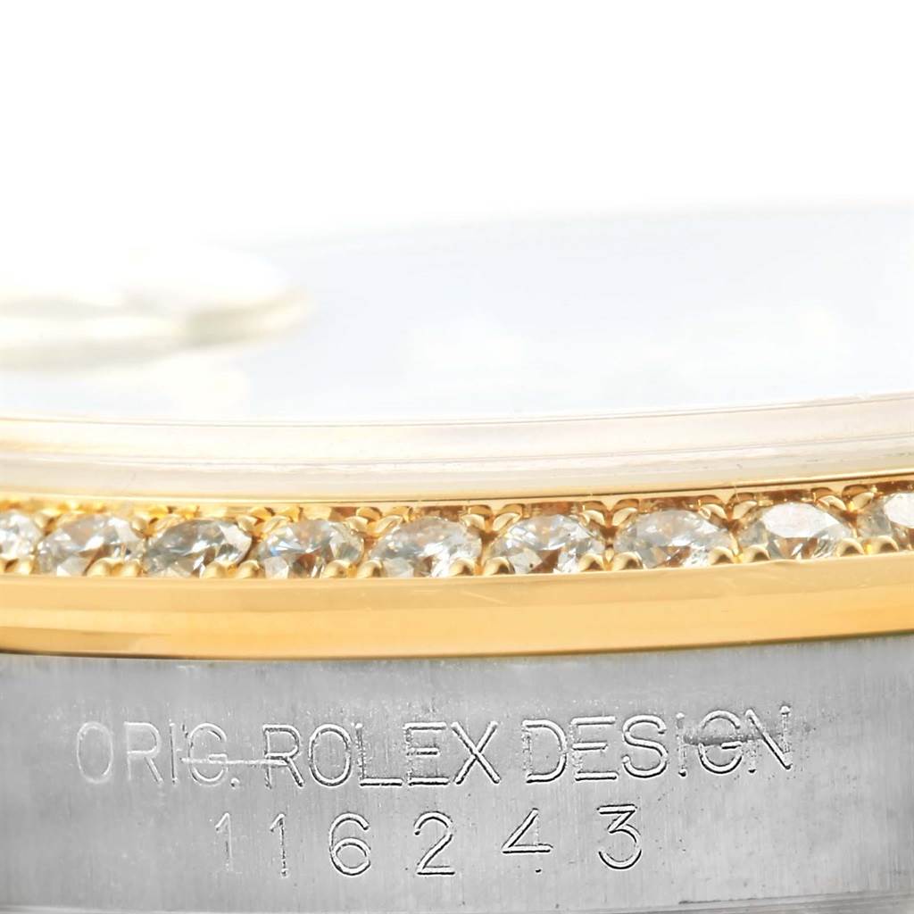 This image shows a close-up of the side of the Rolex Datejust 116243 Women's Stainless Steel Mother of Pearl Dial 116243 Women's Stainless Steel Mother of Pearl Dial watch case, highlighting its engraved serial number and diamond-set bezel.