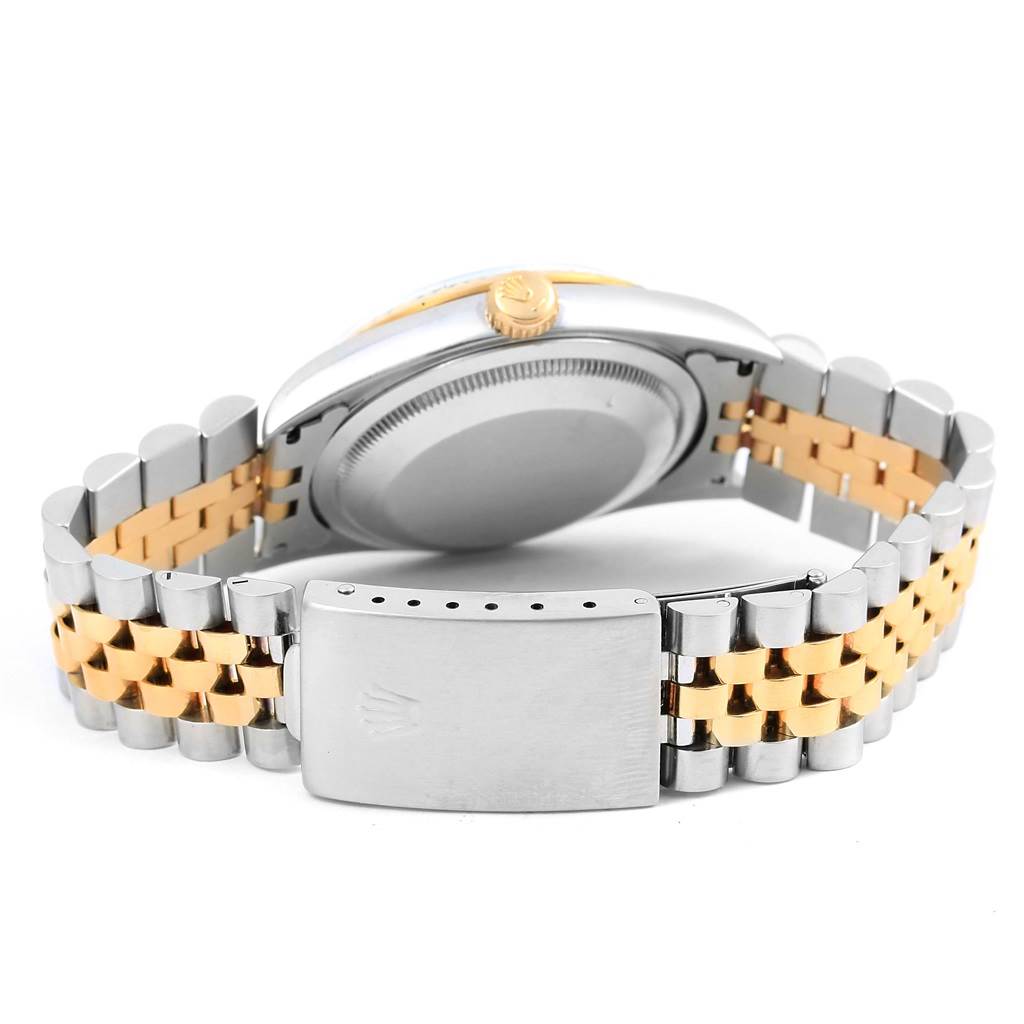 The image shows the back of a Rolex Datejust 16233 Men's Steel and Gold (two tone) White Dial 16233 Men's Steel and Gold (two tone) White Dial watch, highlighting its two-tone metal bracelet and clasp.