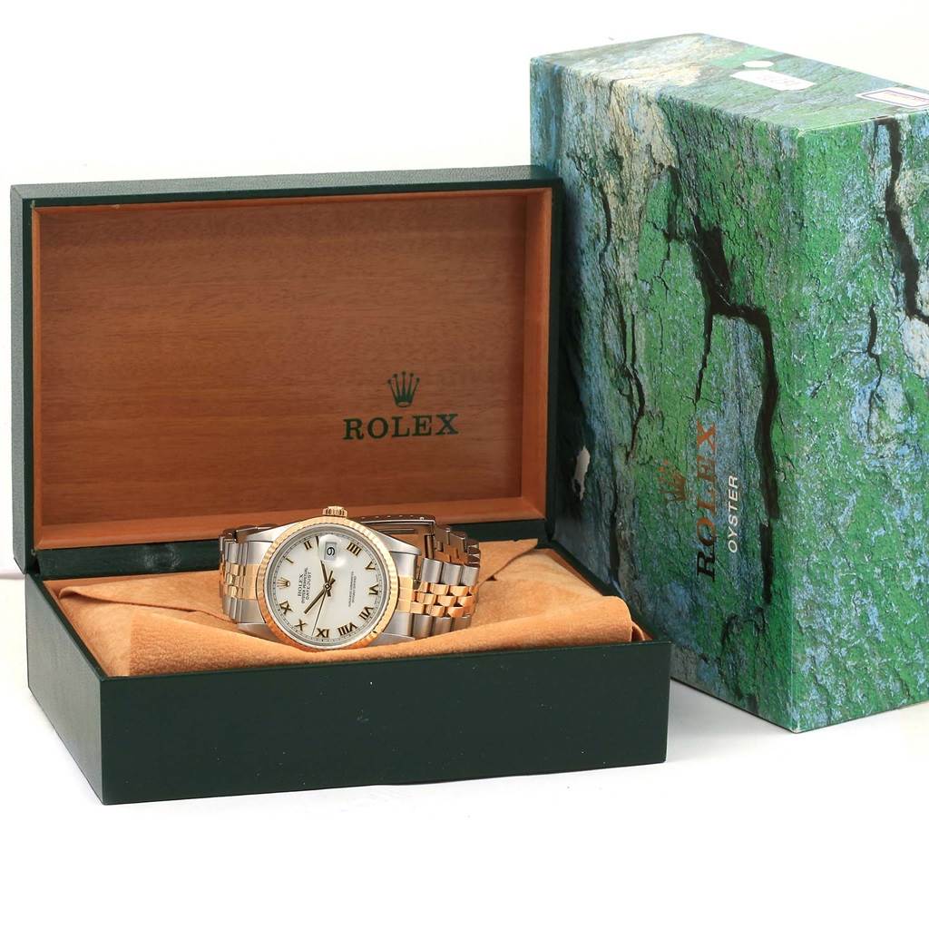 The Rolex Datejust 16233 Men's Steel and Gold (two tone) White Dial 16233 Men's Steel and Gold (two tone) White Dial watch is shown at a front angle in its open box, beside the outer packaging.
