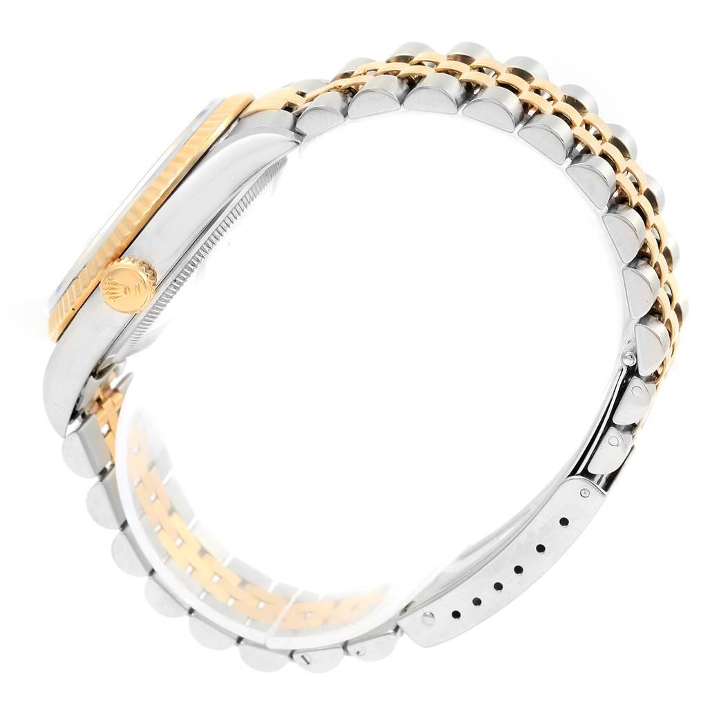 The image shows a side view of the case and bracelet of a Rolex Datejust 16233 Men's Steel and Gold (two tone) White Dial 16233 Men's Steel and Gold (two tone) White Dial watch, highlighting the crown and two-tone metal bracelet.