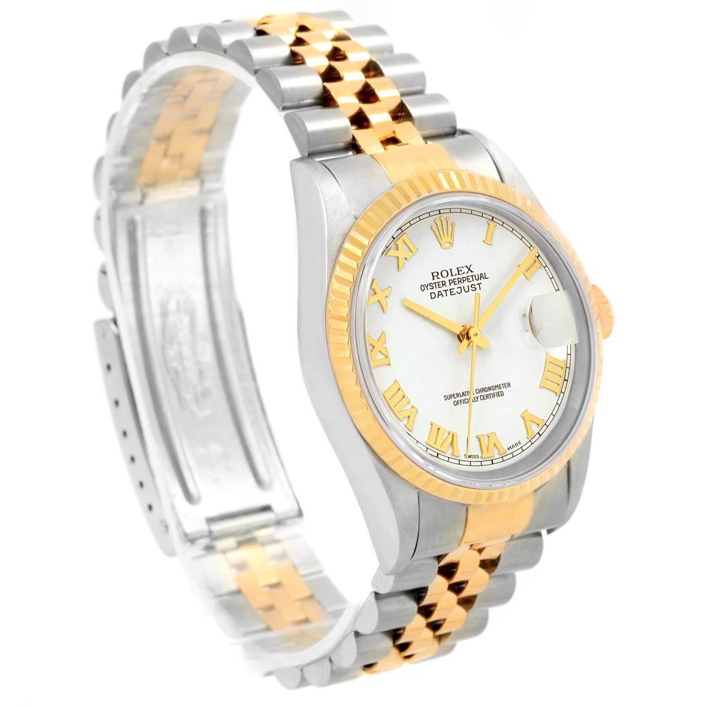 The Rolex Datejust 16233 Men's Steel and Gold (two tone) White Dial 16233 Men's Steel and Gold (two tone) White Dial watch is shown at an angle highlighting its two-tone band, fluted bezel, and white dial with gold Roman numerals.