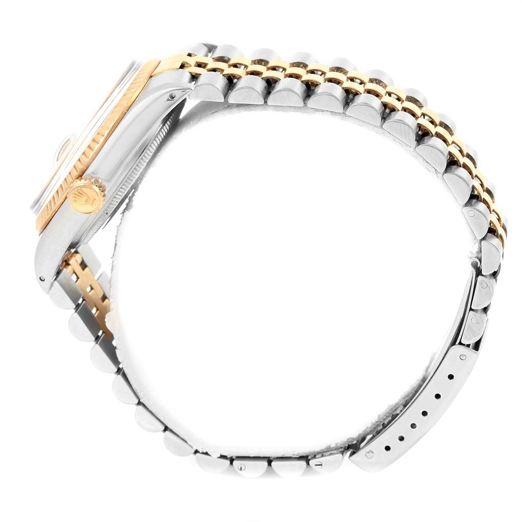 The image shows a side view of a Rolex Datejust 16013 Men's Stainless Steel Champagne Dial 16013 Men's Stainless Steel Champagne Dial watch's case, crown, and bracelet.