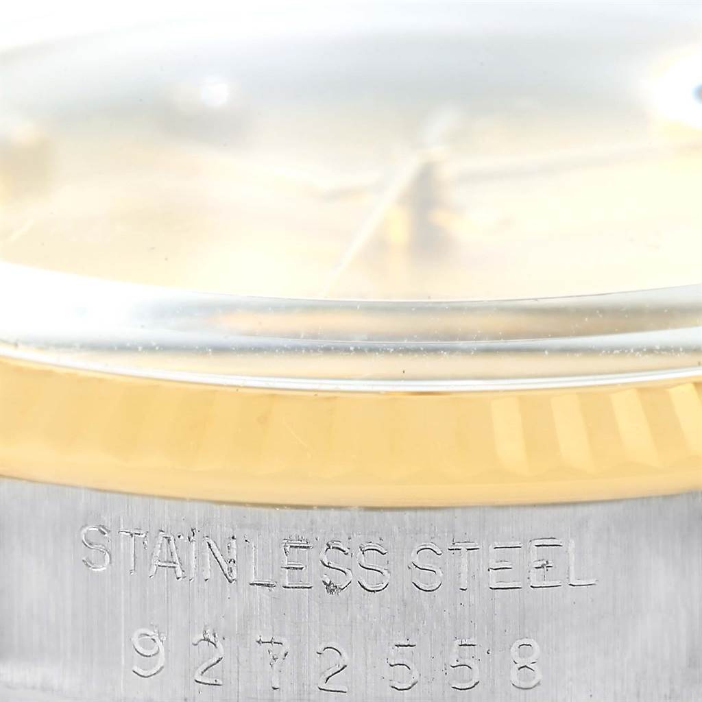 The close-up photo shows the stainless steel case and part of the bezel of the Rolex Datejust 16013 Men's Stainless Steel Champagne Dial 16013 Men's Stainless Steel Champagne Dial watch.