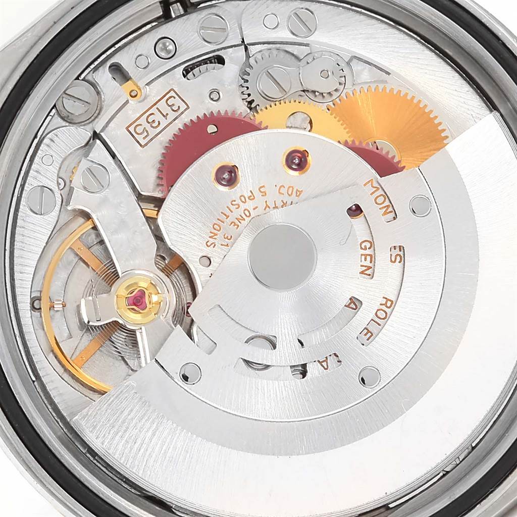 This close-up image shows the inner mechanical movement of the Rolex Datejust 16233 Men's Steel and Gold (two tone) Black Dial 16233 Men's Steel and Gold (two tone) Black Dial watch, highlighting its gears and rotor.