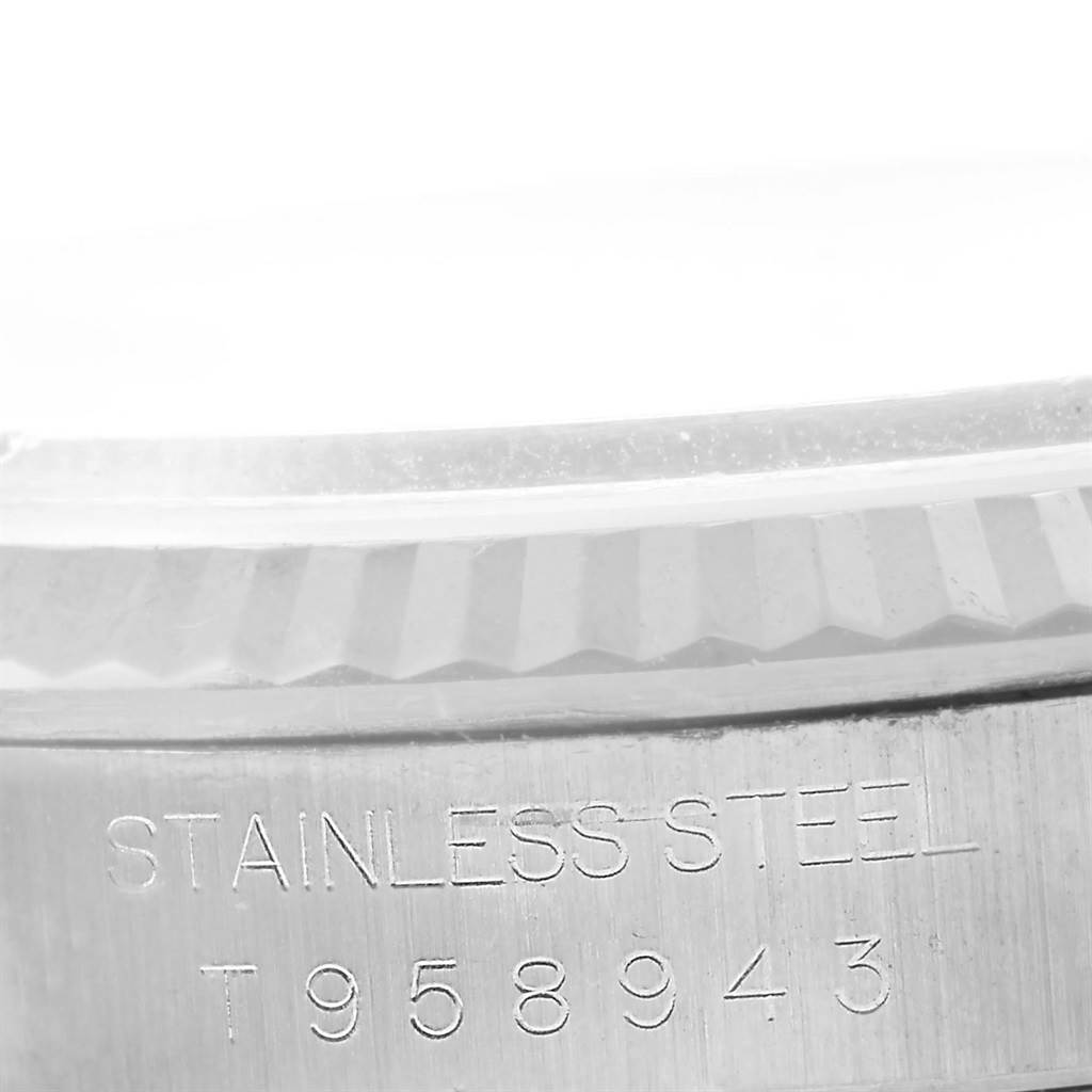 This is a close-up shot of the serial number and stainless steel engraving on the casing of a Rolex Datejust 16234 Men's Stainless Steel Silver Dial 16234 Men's Stainless Steel Silver Dial watch.