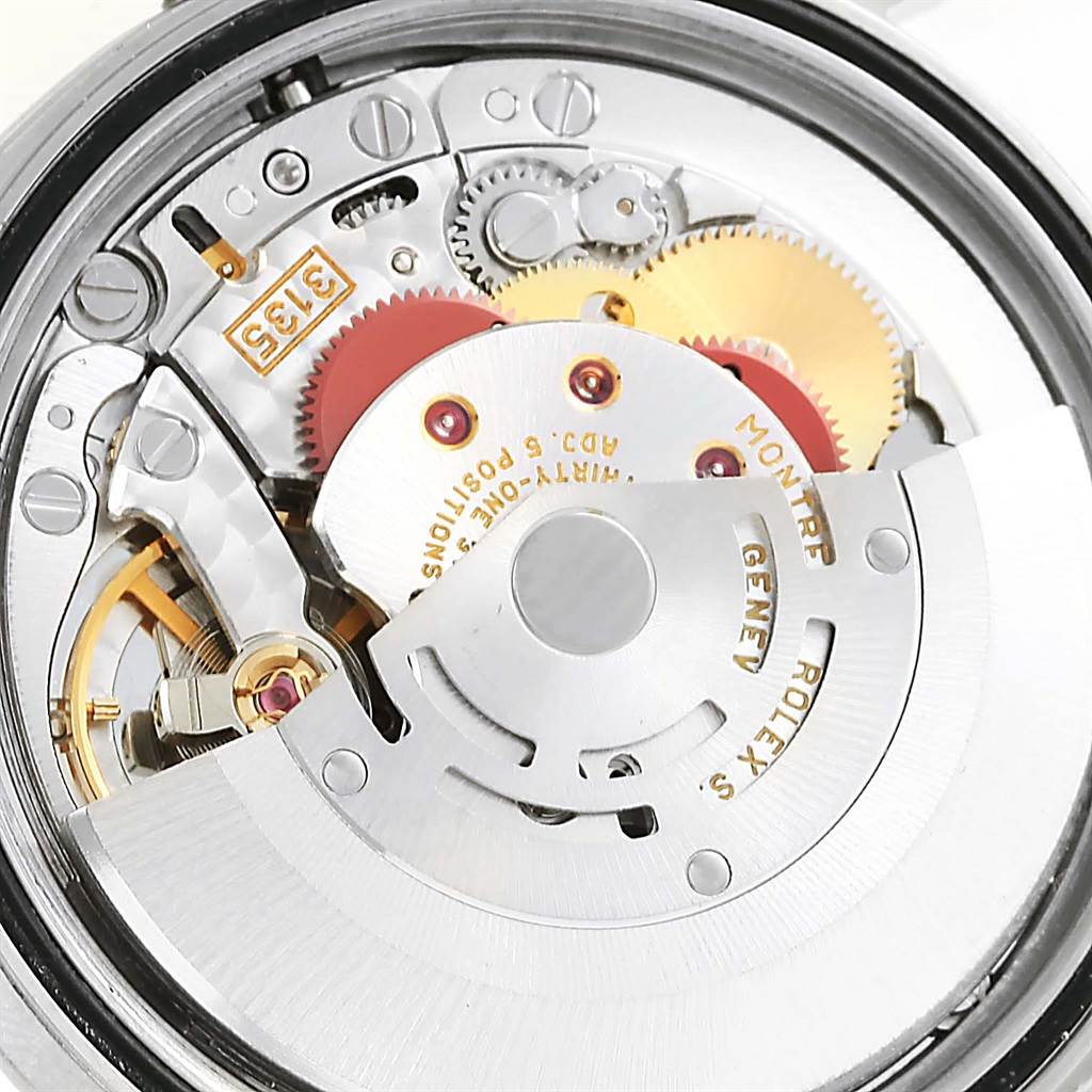 The image shows a close-up view of the movement and internal mechanisms of a Rolex Datejust 16234 Men's Stainless Steel Silver Dial 16234 Men's Stainless Steel Silver Dial watch.