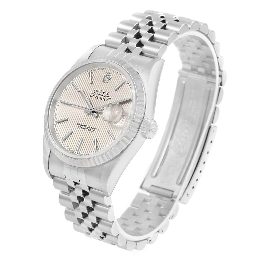 This image shows a side-angle view of a Rolex Datejust 16234 Men's Stainless Steel Silver Dial 16234 Men's Stainless Steel Silver Dial watch, highlighting its silver dial, fluted bezel, and Jubilee bracelet.