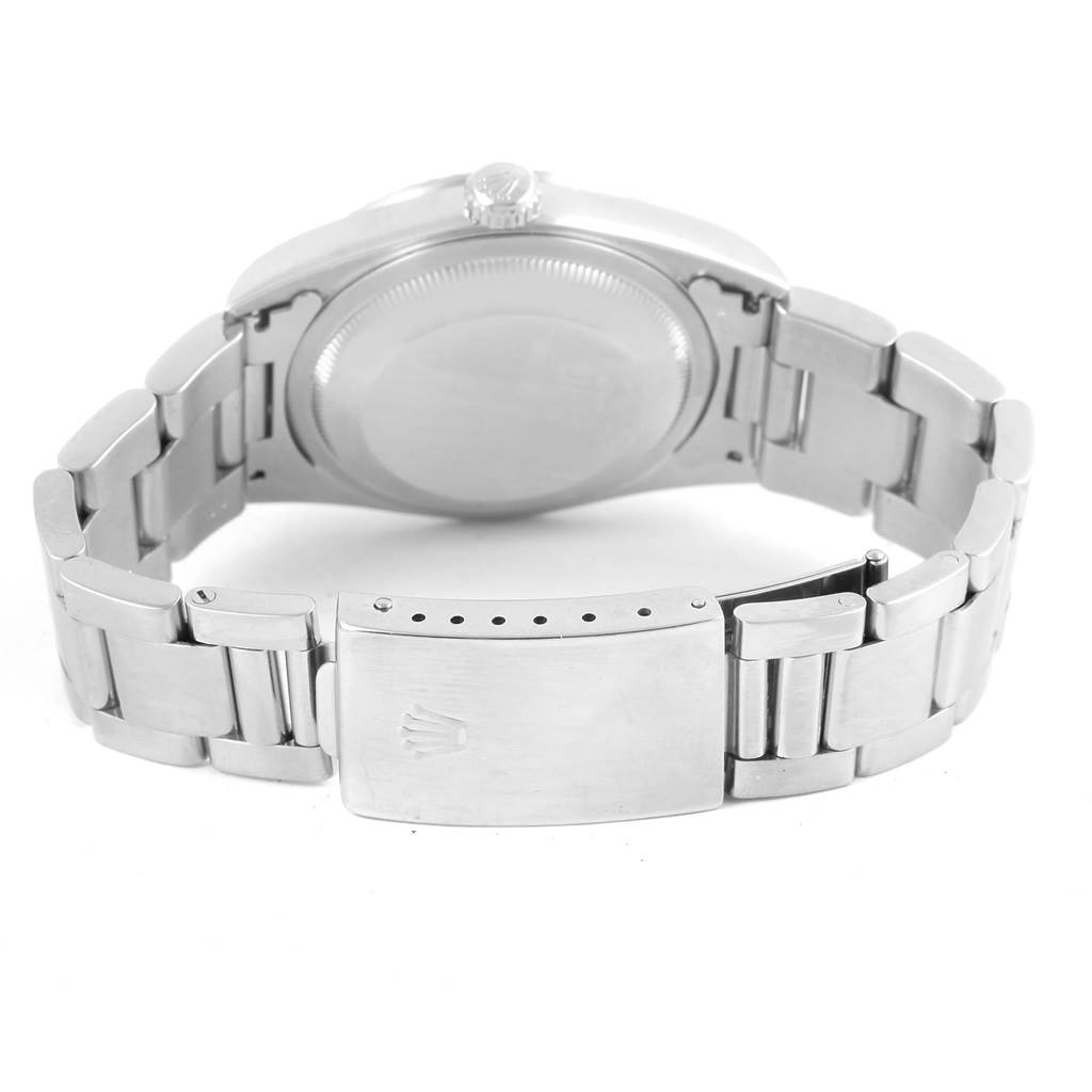 The image shows the back view of the Rolex Datejust 16220 Men's Stainless Steel White Dial 16220 Men's Stainless Steel White Dial, focusing on the case back and metal bracelet with the clasp.