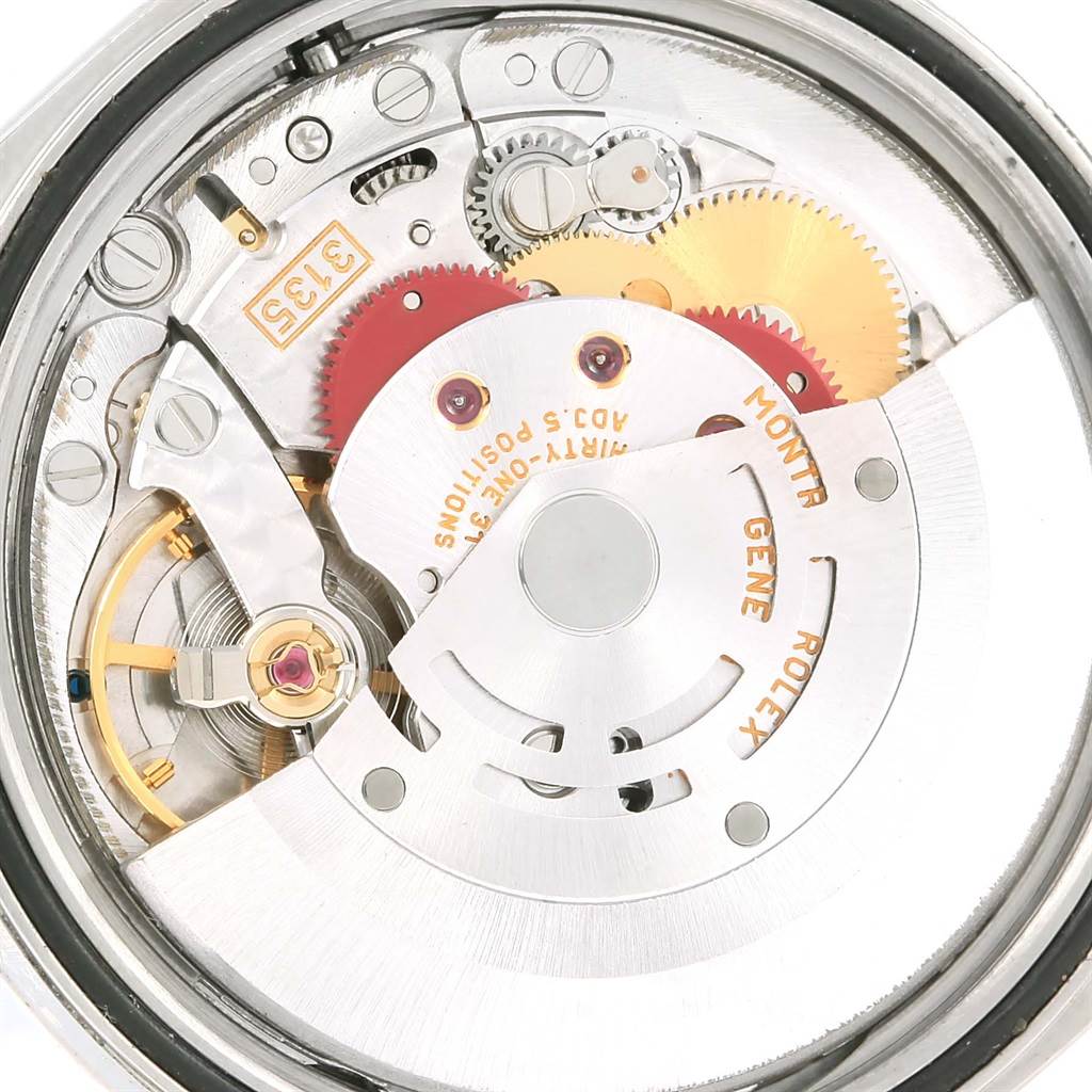 This image shows the inner mechanical movement of a Rolex Datejust 16220 Men's Stainless Steel White Dial 16220 Men's Stainless Steel White Dial watch, revealing gears and intricate components.