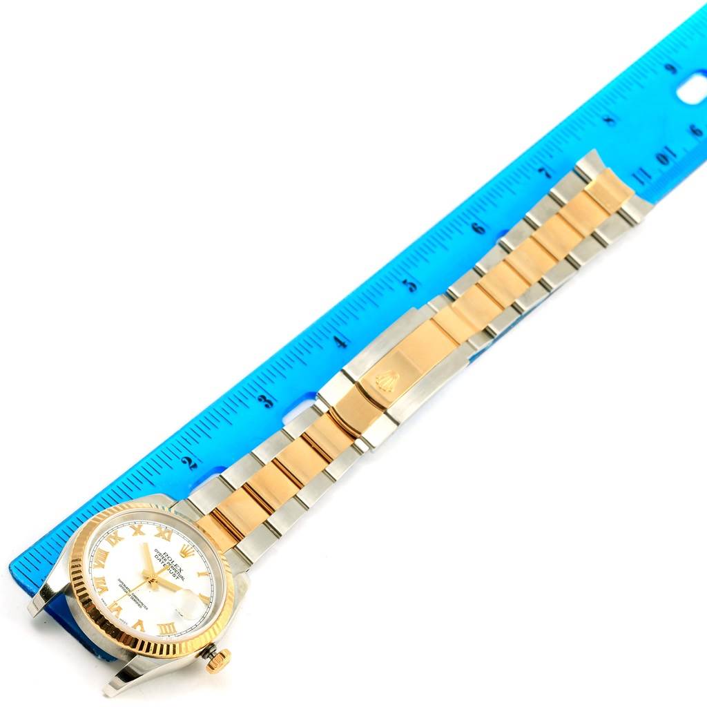 The image shows a Rolex Datejust 116233 Men's Stainless Steel White Dial 116233 Men's Stainless Steel White Dial watch, displaying the face, bracelet, clasp, and part of the ruler for scale.