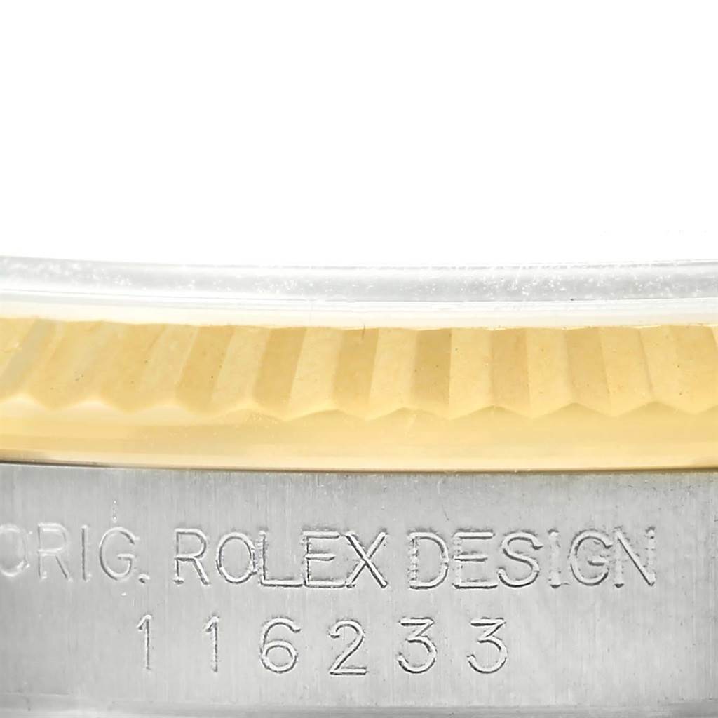 This image shows a close-up of the case side and fluted bezel of a Rolex Datejust 116233 Men's Stainless Steel White Dial 116233 Men's Stainless Steel White Dial model, revealing the model number 116233.