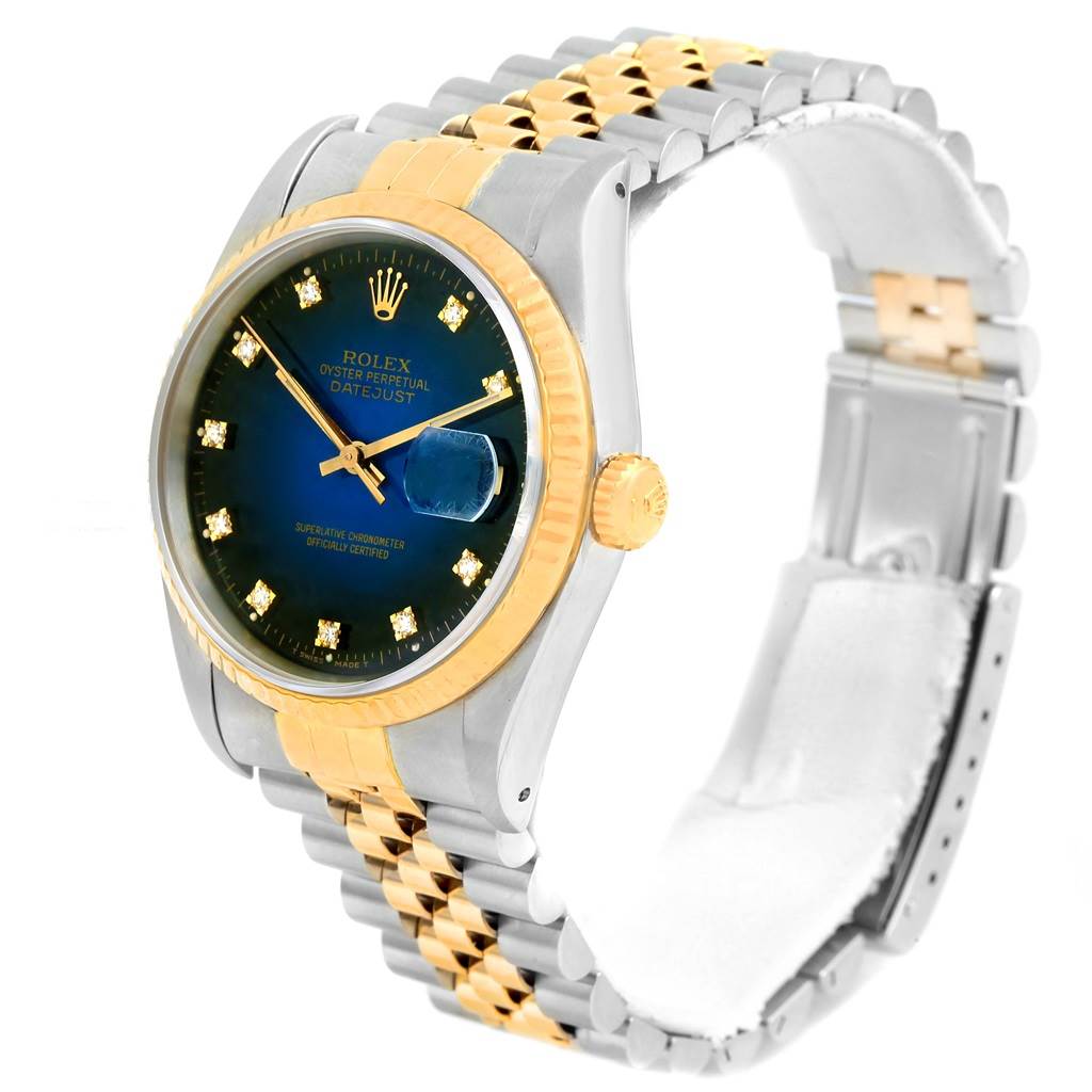The image shows a Rolex Datejust 16233 Men's Steel and Gold (two tone) Blue Dial 16233 Men's Steel and Gold (two tone) Blue Dial watch at an angle, highlighting its blue dial, oyster case, and two-tone jubilee bracelet.