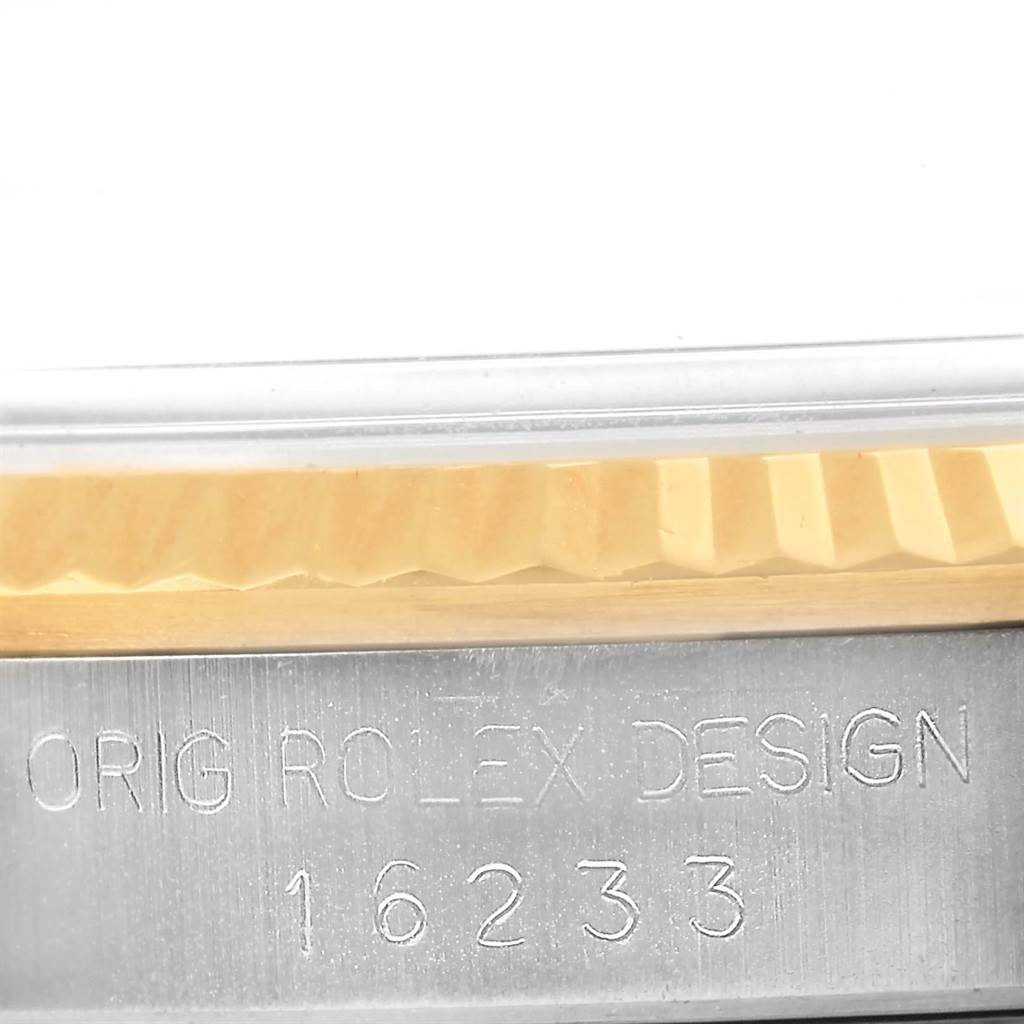 The image shows a close-up of the side marking and bezel of a Rolex Datejust 16233 Steel and Gold (two tone) Champagne Dial 16233 Steel and Gold (two tone) Champagne Dial model 16233.