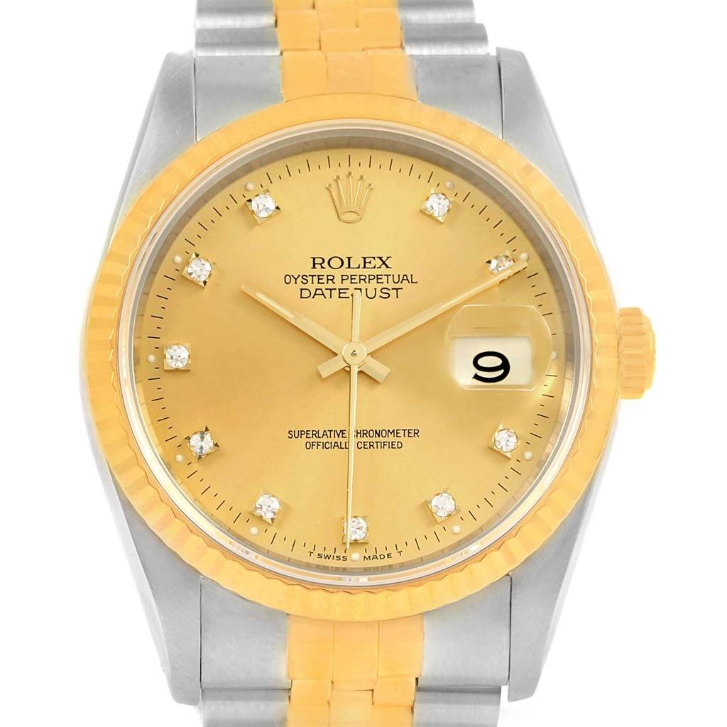 The image shows a frontal view of the Rolex Datejust 16233 Steel and Gold (two tone) Champagne Dial 16233 Steel and Gold (two tone) Champagne Dial watch, featuring a gold dial, fluted bezel, and a two-tone bracelet.