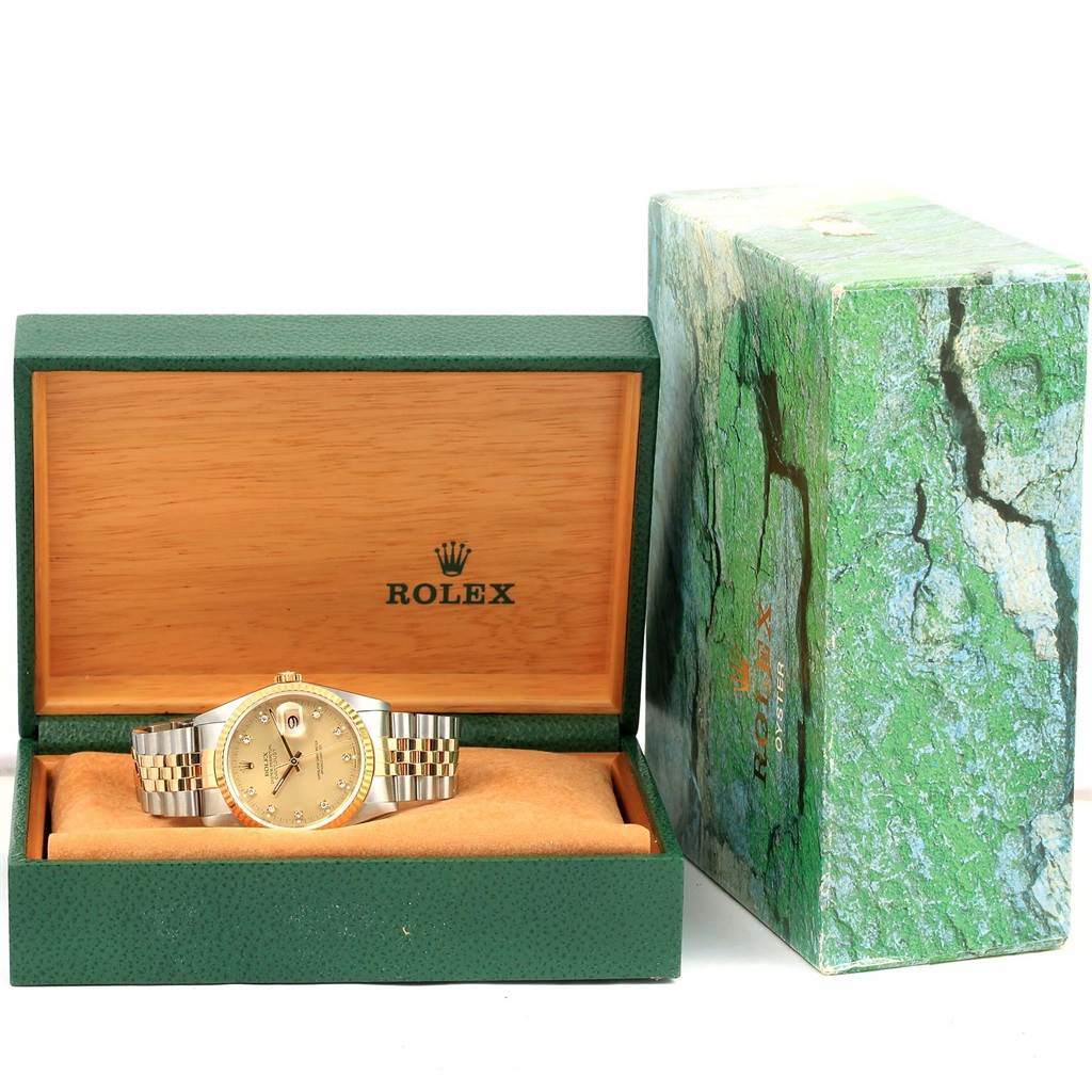 The image shows a Rolex Datejust 16233 Steel and Gold (two tone) Champagne Dial 16233 Steel and Gold (two tone) Champagne Dial watch in its open box, displaying the dial, case, and bracelet, with the original packaging beside it.