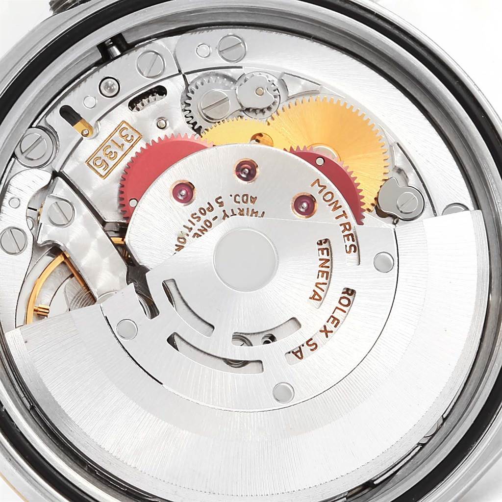 The image shows a close-up view of the Rolex Datejust 16233 Steel and Gold (two tone) Champagne Dial 16233 Steel and Gold (two tone) Champagne Dial movement, highlighting internal gears and mechanisms.