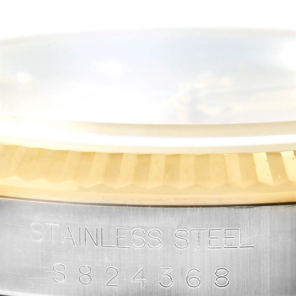 This is a close-up of the serial number and "STAINLESS STEEL" engraving on a Rolex Datejust 16233 Steel and Gold (two tone) Champagne Dial 16233 Steel and Gold (two tone) Champagne Dial model.