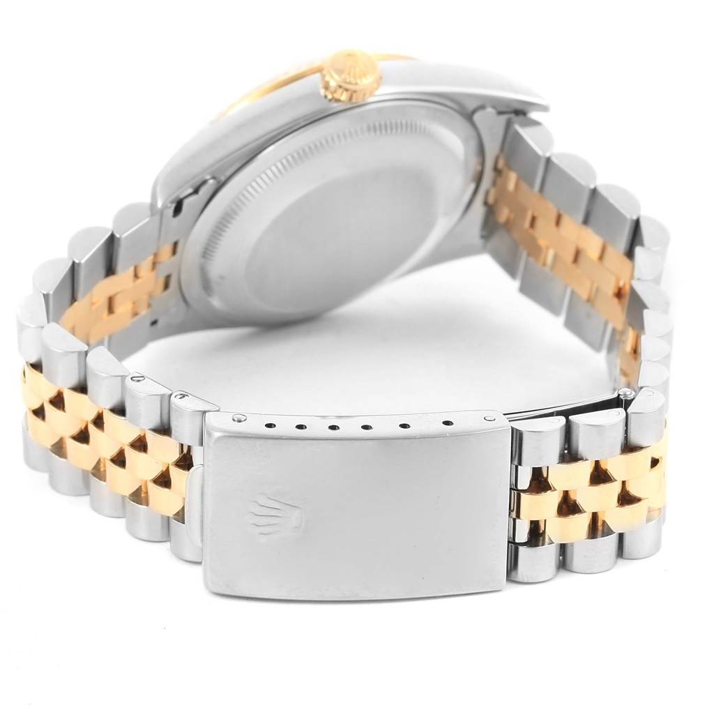 The image shows the back of the Rolex Datejust 16233 Steel and Gold (two tone) Champagne Dial 16233 Steel and Gold (two tone) Champagne Dial, focusing on the clasp, bracelet, and case back.