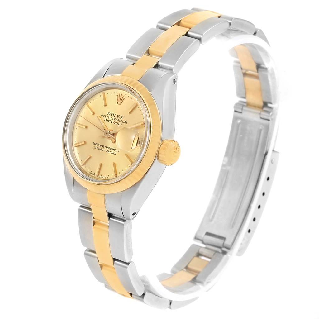 The Rolex Datejust 6917 Women's Stainless Steel Champagne Dial 6917 Women's Stainless Steel Champagne Dial watch is shown at an angle displaying its dial, crown, bezel, and two-tone bracelet.