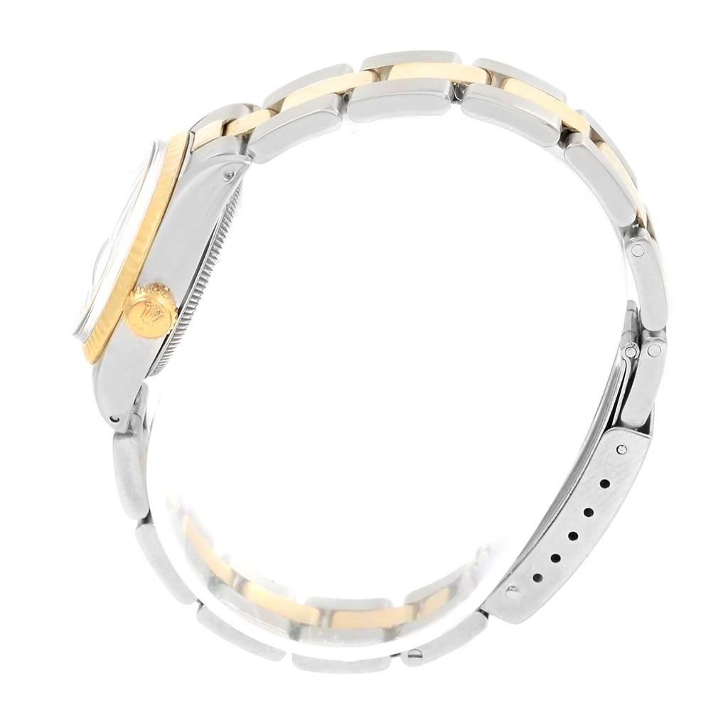 The image shows a side view of a Rolex Datejust 6917 Women's Stainless Steel Champagne Dial 6917 Women's Stainless Steel Champagne Dial watch, highlighting its two-tone bracelet and crown.