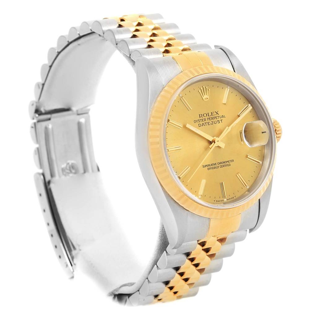 The Rolex Datejust 16233 Men's Steel and Gold (two tone) Champagne Dial 16233 Men's Steel and Gold (two tone) Champagne Dial watch is shown at a three-quarter angle, highlighting the gold dial, fluted bezel, and two-tone Jubilee bracelet.