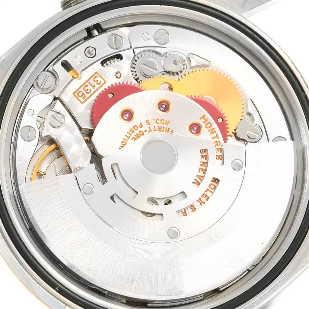 The image shows an internal view of the Rolex Datejust 16233 Men's Steel and Gold (two tone) Champagne Dial 16233 Men's Steel and Gold (two tone) Champagne Dial's watch movement mechanism from a close-up, angled from the back.